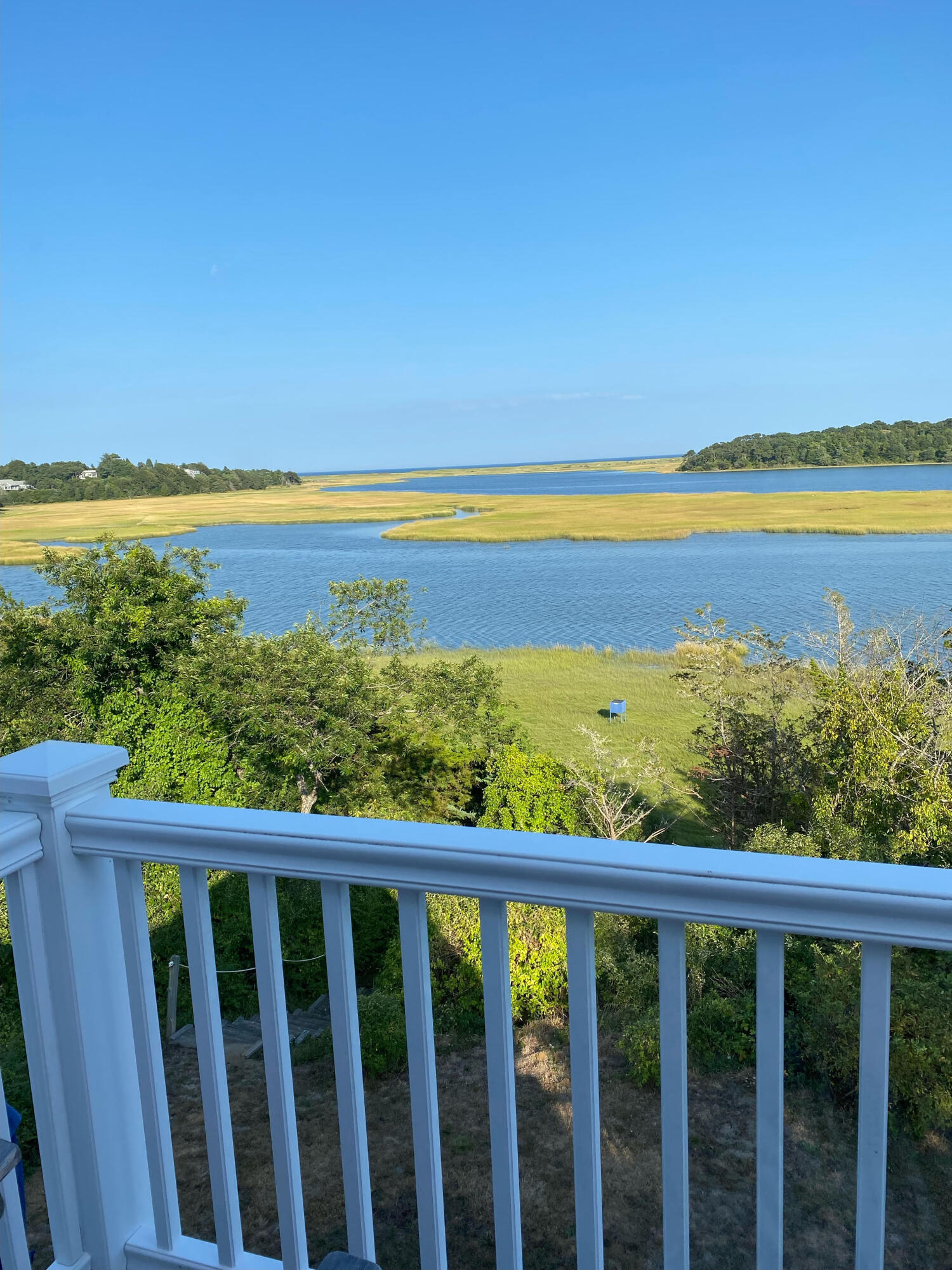 63 Briar Spring Road Orleans, MA 02653 - Photo 20 of 37 a view of an ocean from a balcony