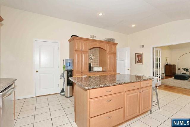 84 12th Street Cresskill, NJ 07626 - Photo 21 of 45 a spacious bathroom with a granite countertop sink and a mirror
