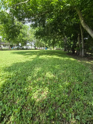a view of outdoor space with deck and yard