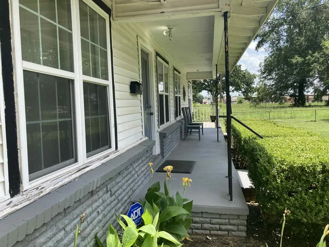 a view of a balcony with chairs
