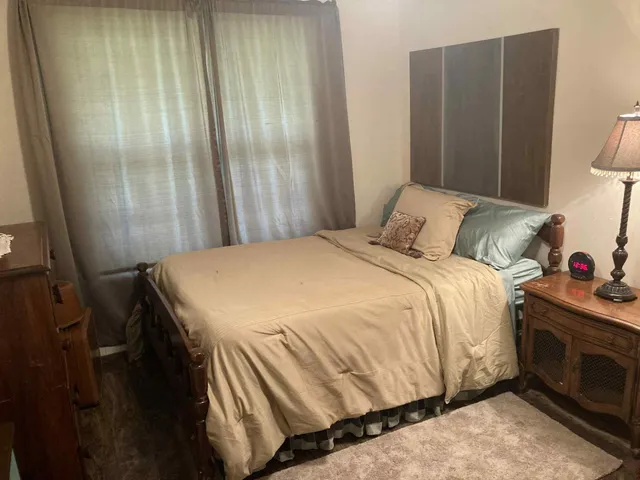 a bedroom with a bed and a closet