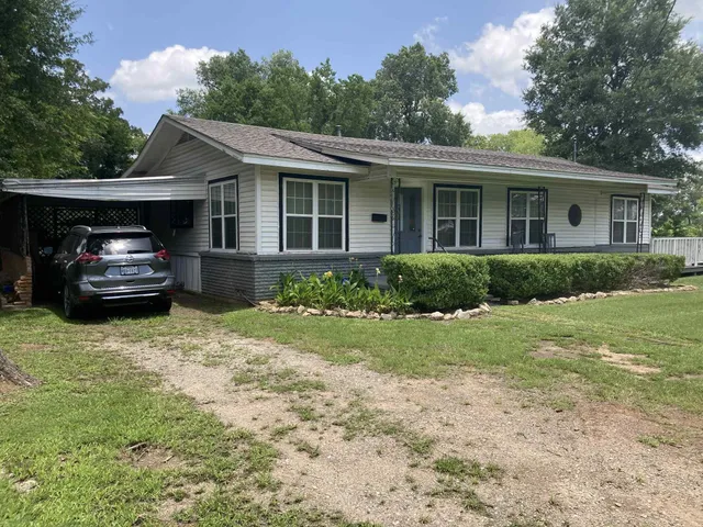 a house view with a garden space