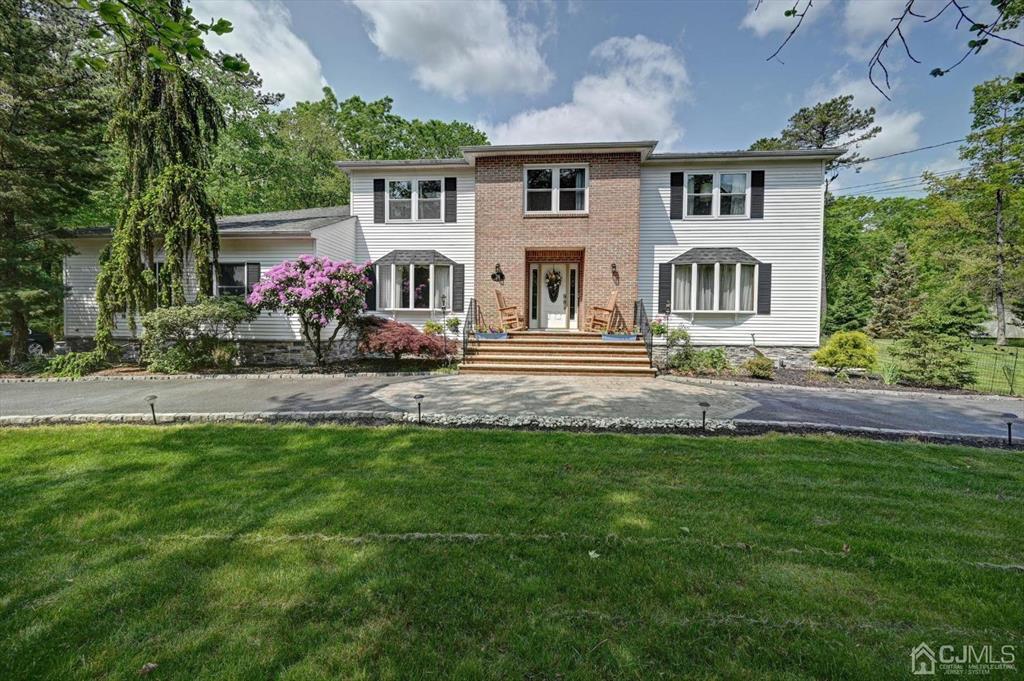 38 Pittenger Pond Road Freehold, NJ 07728 - Photo 1 of 43 a front view of house with yard