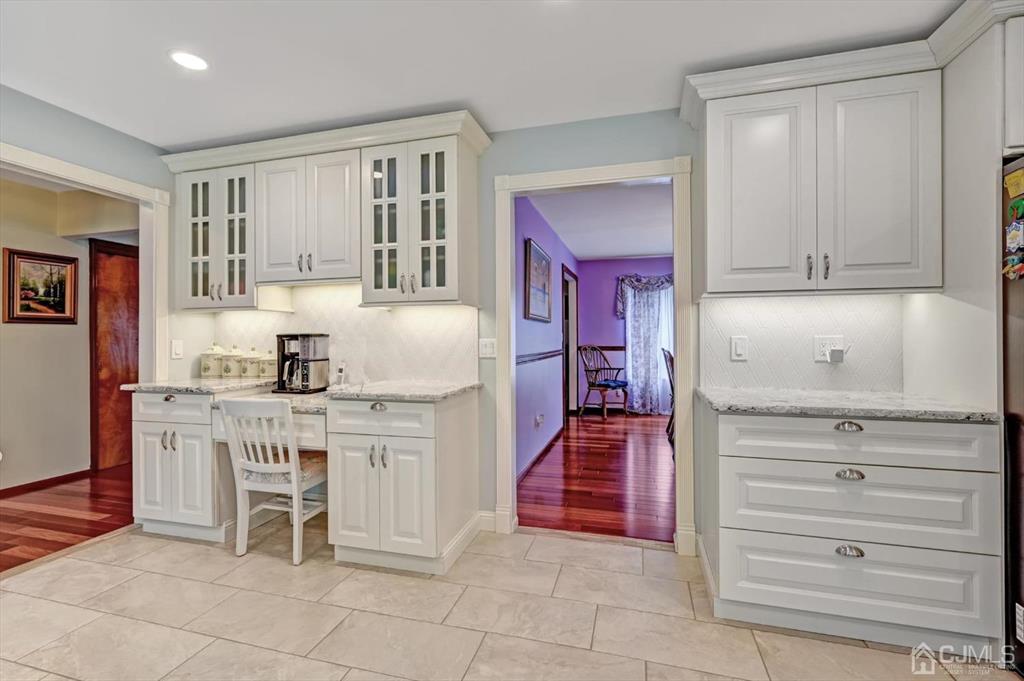38 Pittenger Pond Road Freehold, NJ 07728 - Photo 13 of 43 a kitchen with cabinets and chairs