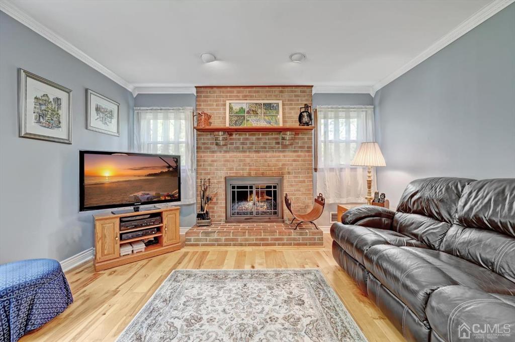 38 Pittenger Pond Road Freehold, NJ 07728 - Photo 19 of 43 a living room with furniture and a flat screen tv