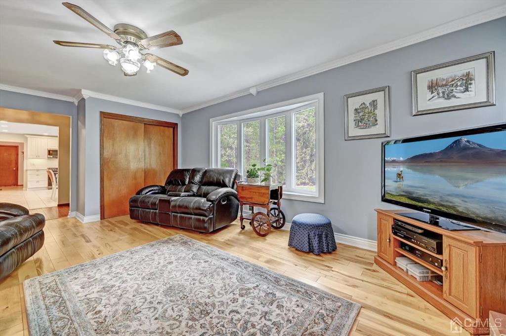 38 Pittenger Pond Road Freehold, NJ 07728 - Photo 20 of 43 a living room with furniture and a flat screen tv