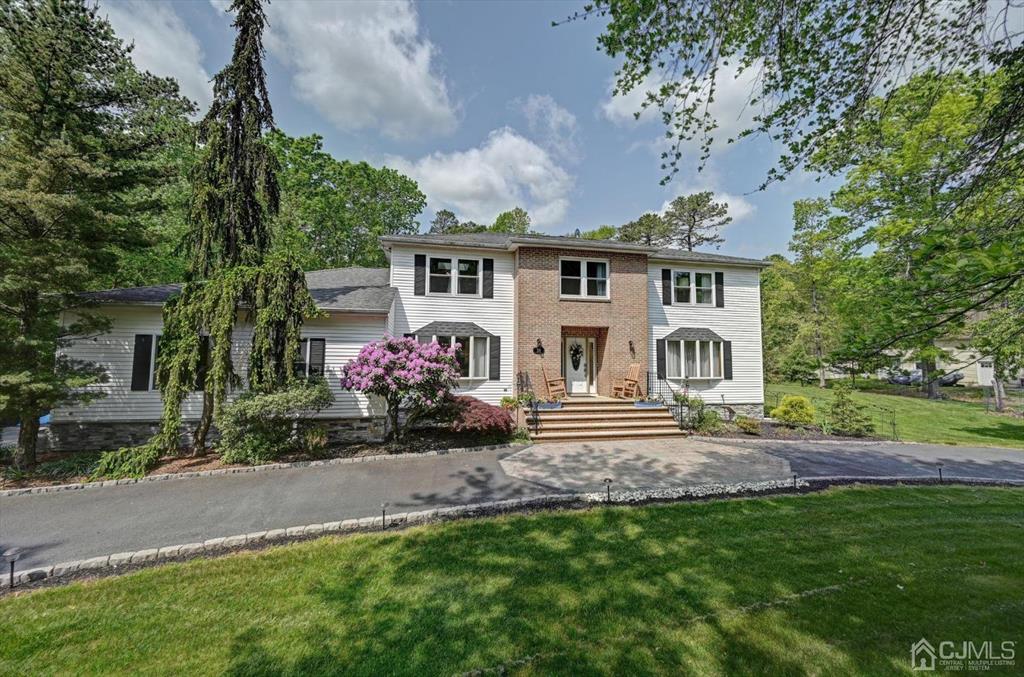 38 Pittenger Pond Road Freehold, NJ 07728 - Photo 2 of 43 a front view of a house with garden