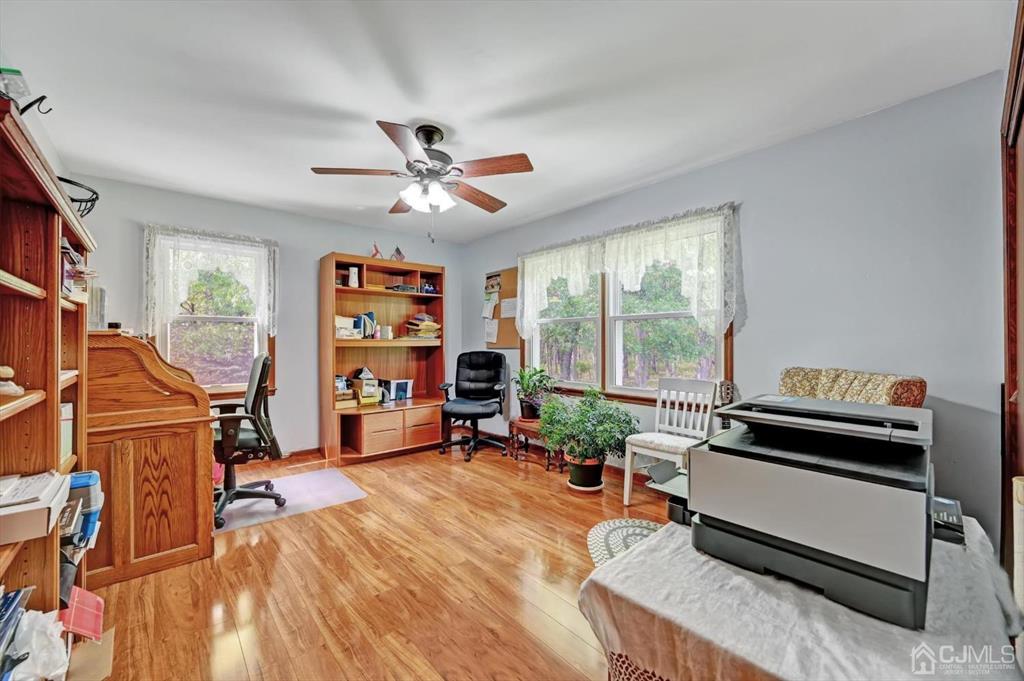 38 Pittenger Pond Road Freehold, NJ 07728 - Photo 21 of 43 a living room with furniture gym equipment and a window