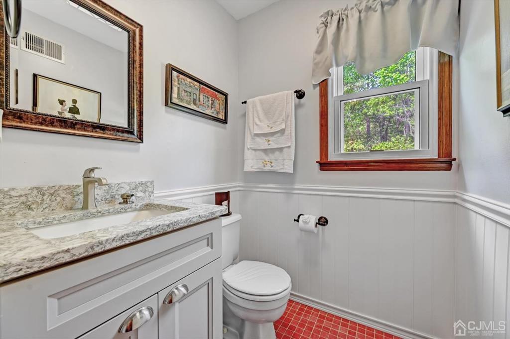 38 Pittenger Pond Road Freehold, NJ 07728 - Photo 22 of 43 a bathroom with a granite countertop sink a toilet and a window