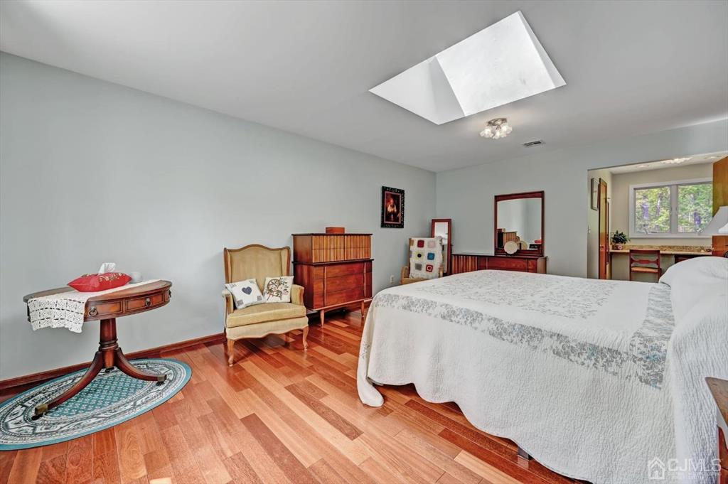 38 Pittenger Pond Road Freehold, NJ 07728 - Photo 25 of 43 a bed room with a bed and a chair