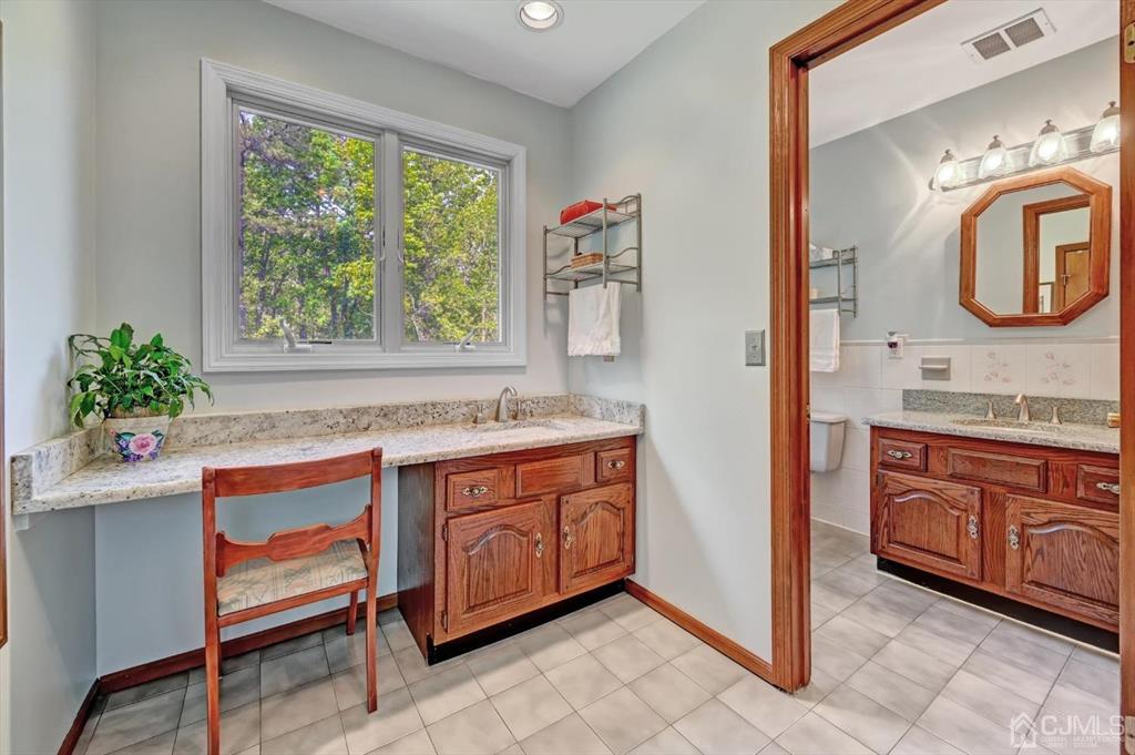 38 Pittenger Pond Road Freehold, NJ 07728 - Photo 26 of 43 a bathroom with a granite countertop sink and a mirror