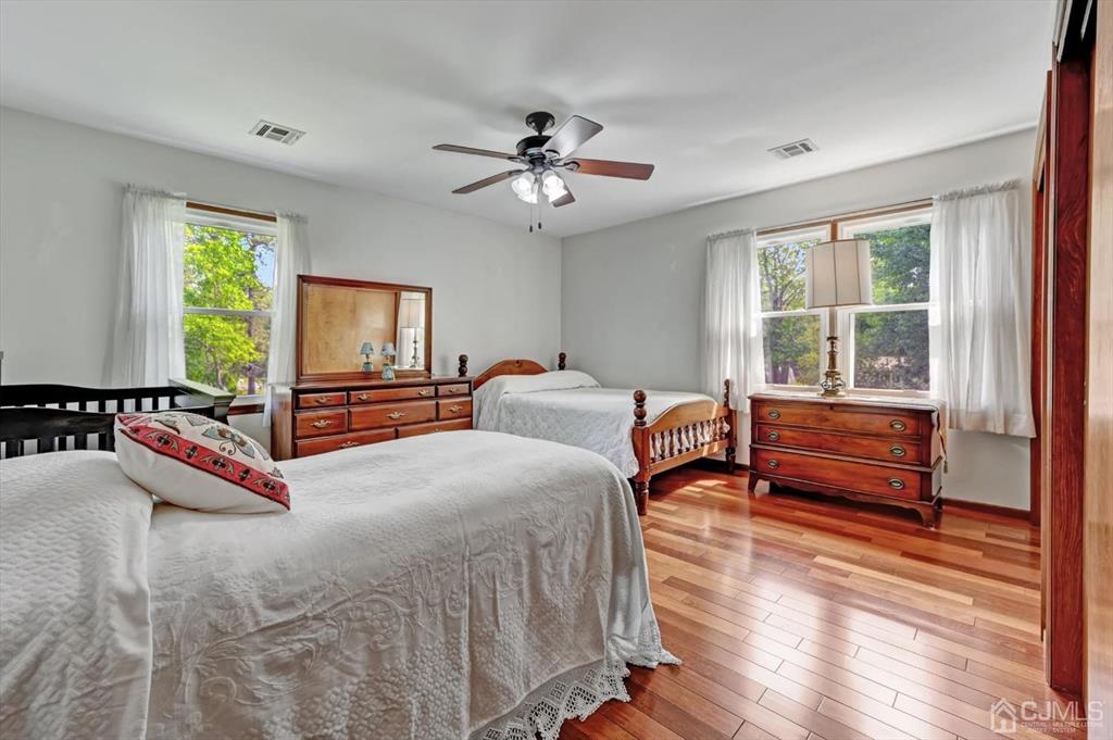 38 Pittenger Pond Road Freehold, NJ 07728 - Photo 30 of 43 a bedroom with a bed and a dresser with mirror