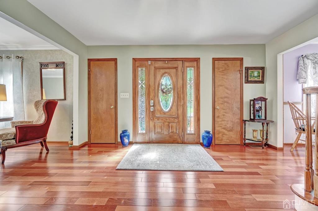 38 Pittenger Pond Road Freehold, NJ 07728 - Photo 3 of 43 a view of a livingroom with furniture and floor to ceiling windows