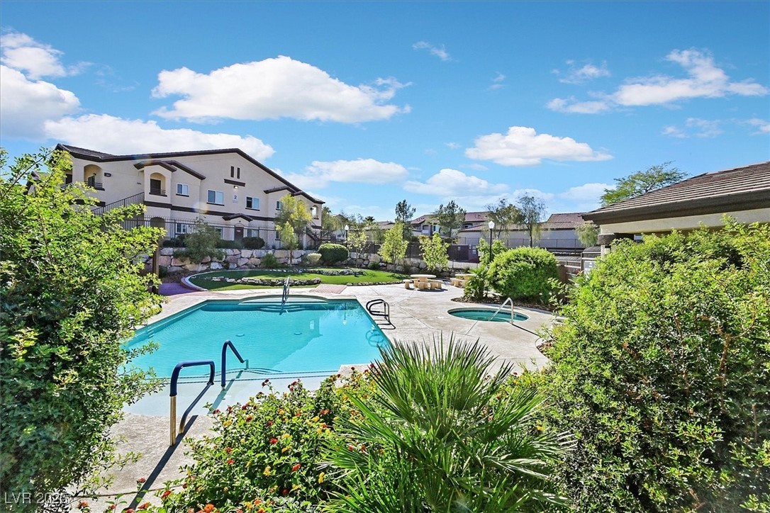 2291 West Horizon Ridge Parkway, Unit 1206 Henderson, NV 89052 - Photo 18 of 29 Community pool with a patio, a residential view, and a hot tub