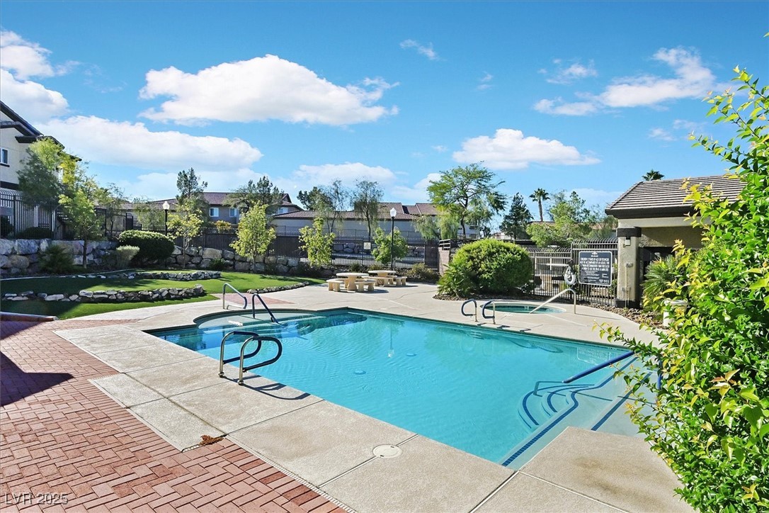 2291 West Horizon Ridge Parkway, Unit 1206 Henderson, NV 89052 - Photo 19 of 29 Community pool featuring a patio area and a residential view