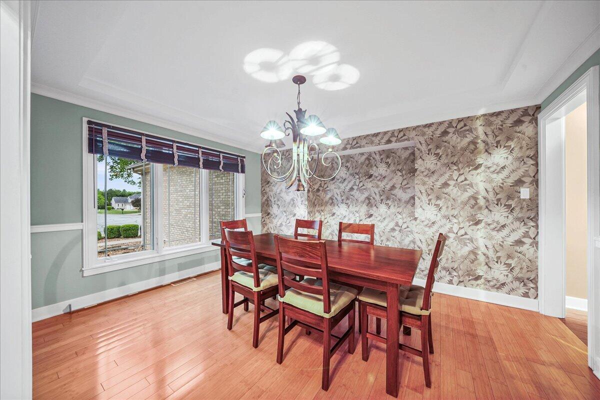 8751 Bridgewater Court Crown Point, IN 46307 - Photo 18 of 49 a view of a dining room with furniture window and outside view