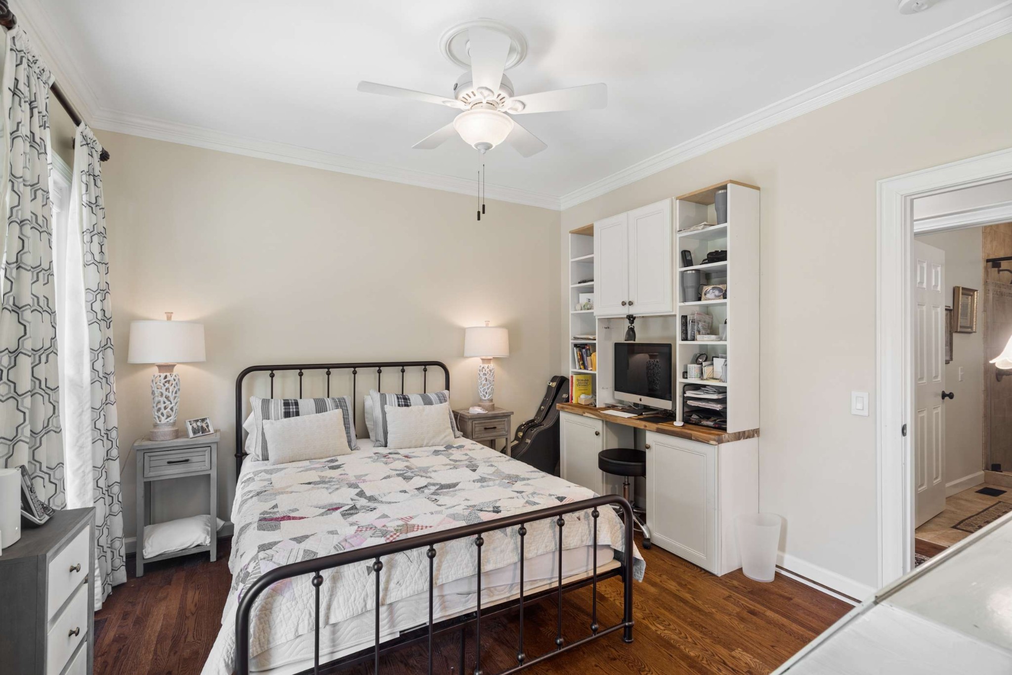 2723 Abbott Martin Road Nashville, TN 37215 - Photo 23 of 45 a bedroom with a bed and a chandelier