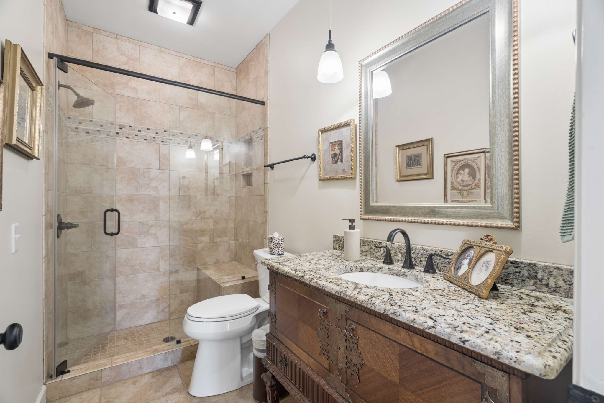 2723 Abbott Martin Road Nashville, TN 37215 - Photo 24 of 45 a bathroom with a granite countertop sink toilet a mirror and shower