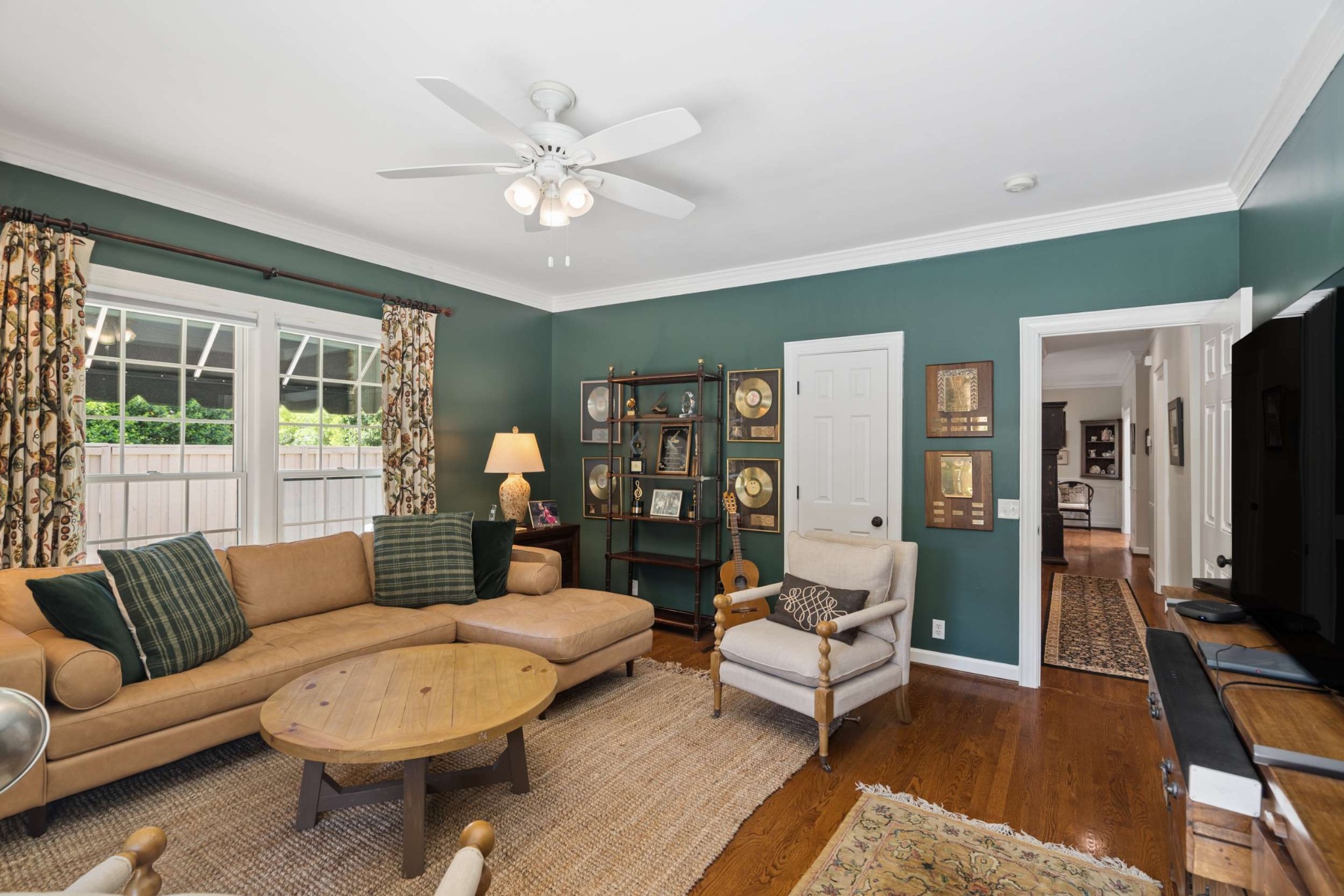2723 Abbott Martin Road Nashville, TN 37215 - Photo 27 of 45 a living room with furniture a flat screen tv and a large window