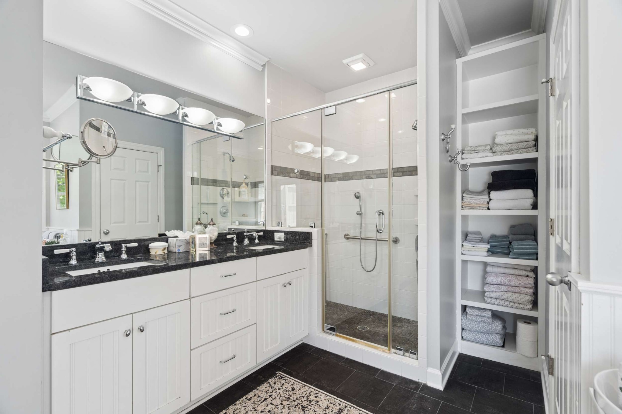 2723 Abbott Martin Road Nashville, TN 37215 - Photo 32 of 45 a bathroom with a double vanity sink mirror and shower