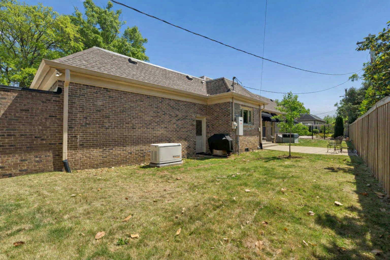 2723 Abbott Martin Road Nashville, TN 37215 - Photo 44 of 45 a backyard of a house with table and chairs
