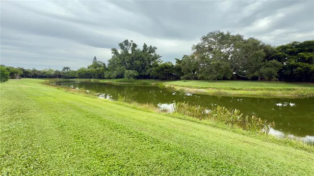 a balcony with couple of chairs and a couch