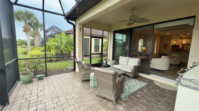 a large kitchen with stainless steel appliances granite countertop a sink stove and wooden floor