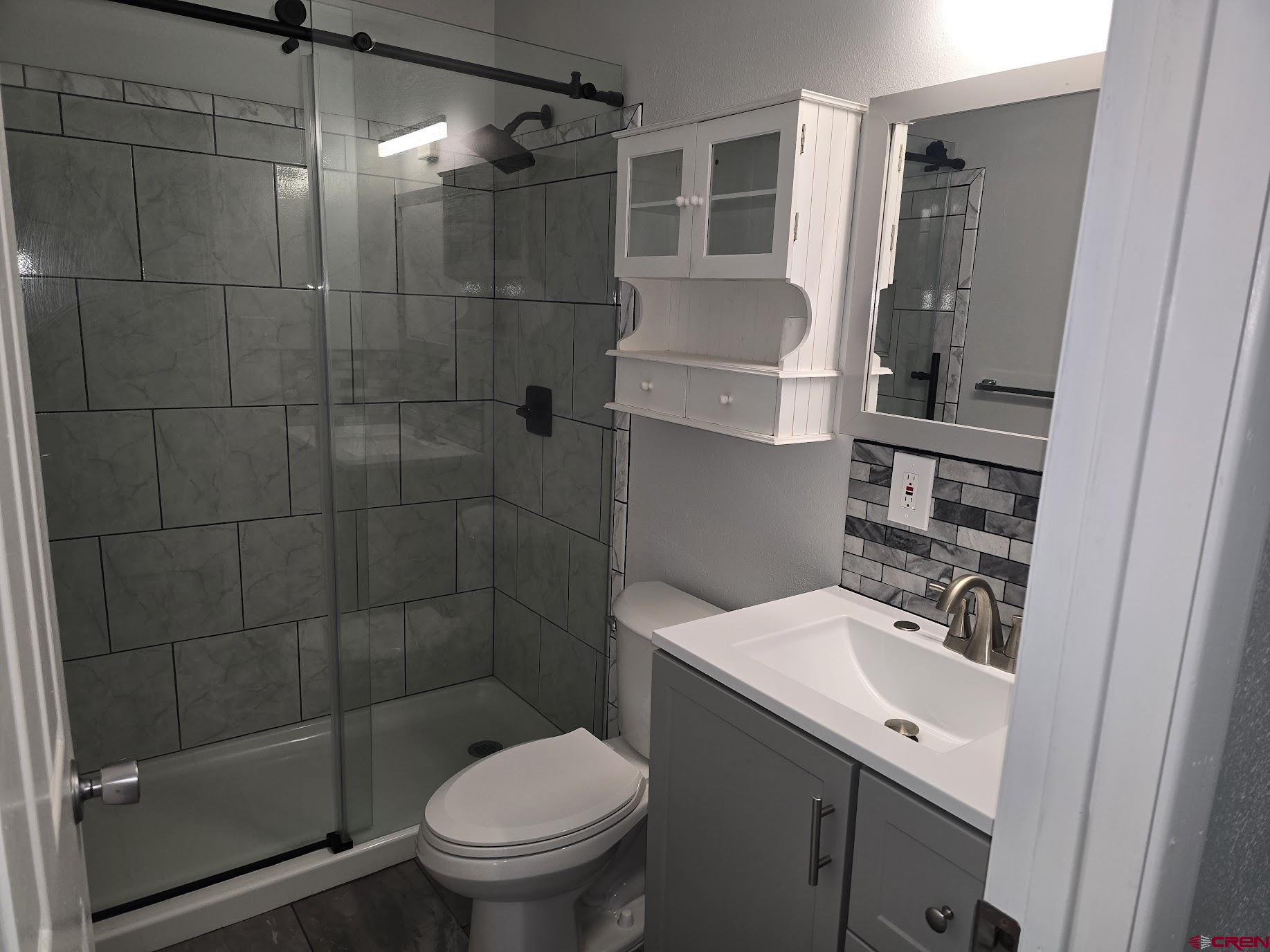34237 Highway 550, Unit 9 Durango, CO 81301 - Photo 11 of 18 a bathroom with a shower toilet and sink