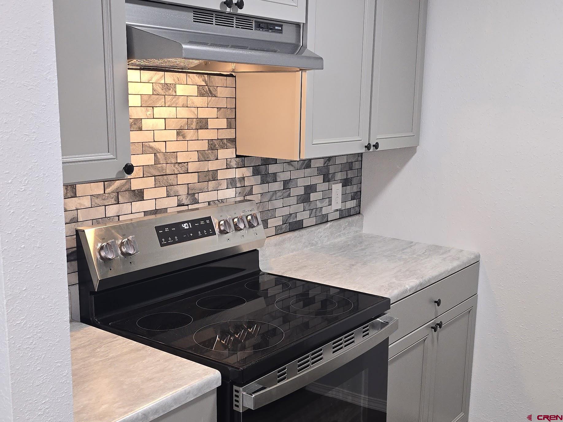34237 Highway 550, Unit 9 Durango, CO 81301 - Photo 17 of 18 a stove top oven sitting inside of a kitchen