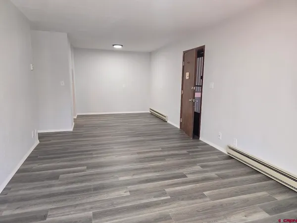 a view of balcony with furniture and wooden deck