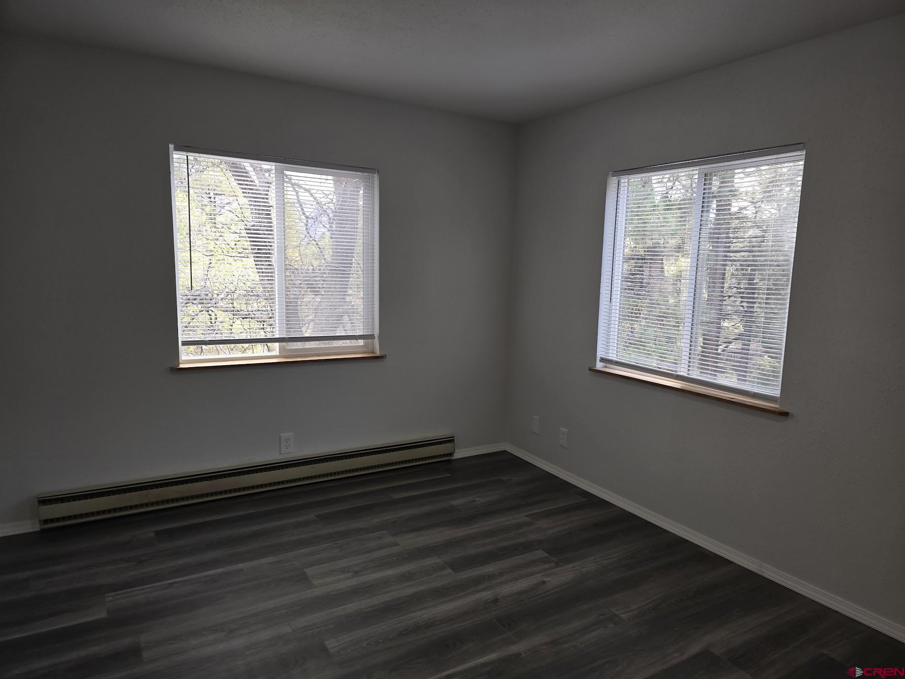 34237 Highway 550, Unit 9 Durango, CO 81301 - Photo 9 of 18 a view of a room with wooden floor and windows