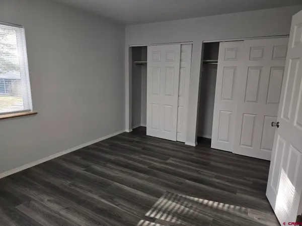 a bathroom with a shower toilet and sink