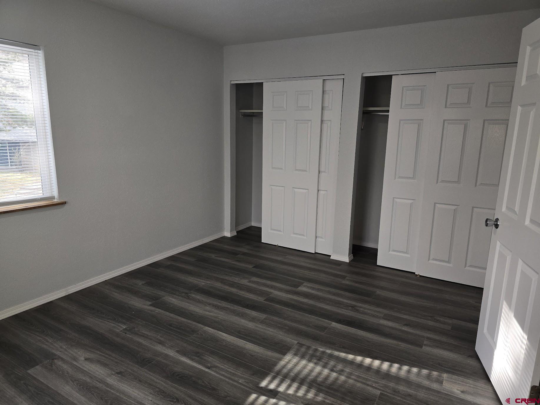 34237 Highway 550, Unit 9 Durango, CO 81301 - Photo 10 of 18 a view of empty room with wooden floor and fan