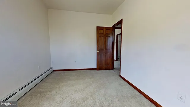a view of an empty room and closet