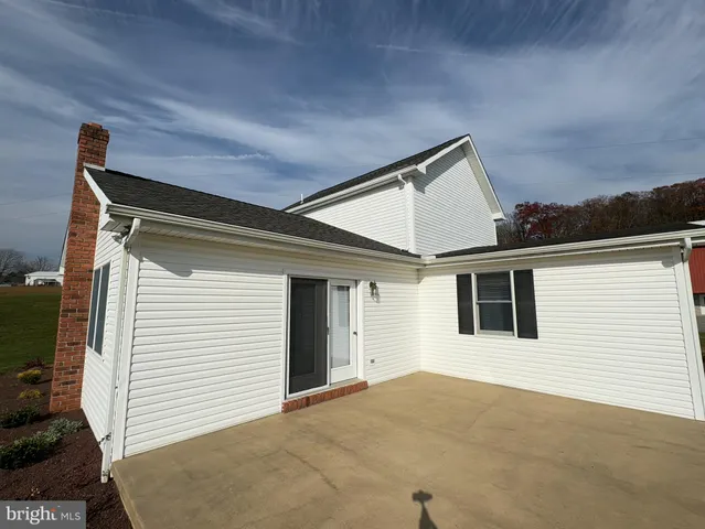 a view of a lake with houses in the background