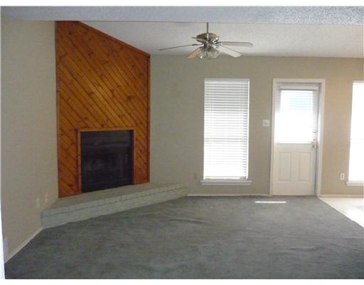 3014 Quail Springs Road, Unit D4 Corpus Christi, TX 78414 - Photo 2 of 2 a view of an empty room with a fireplace