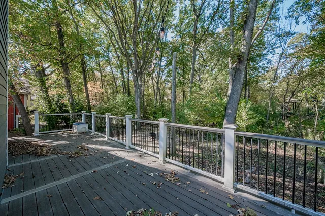 a balcony with wooden floor