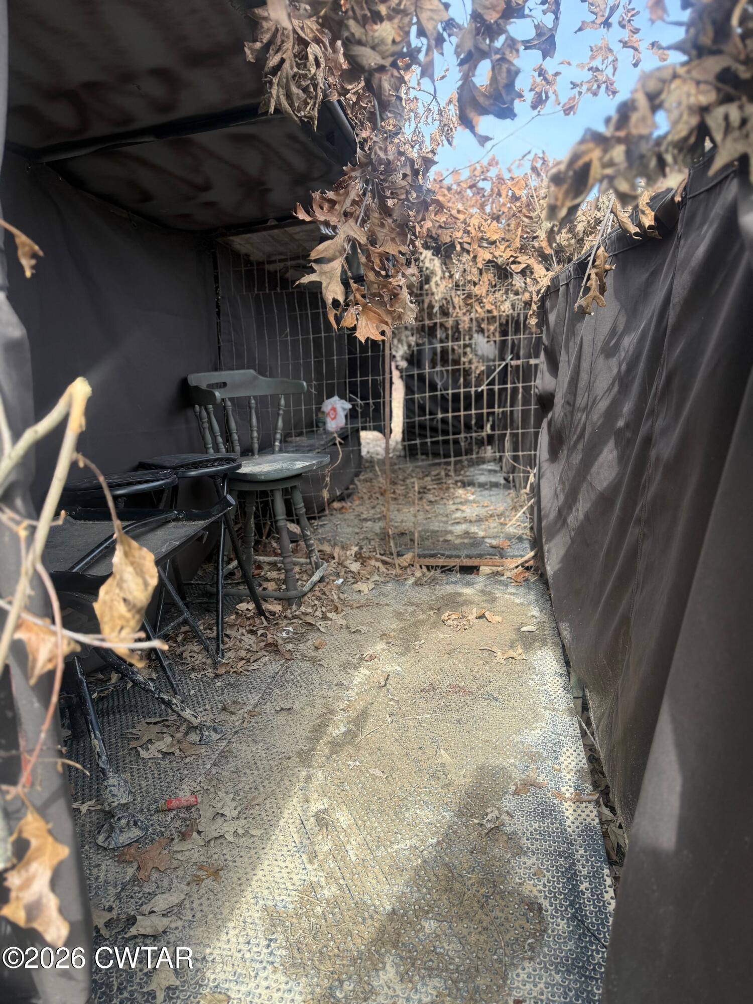 13217-13197 Johnsons Grove Road Halls, TN 38040 - Photo 26 of 34 a view of a backyard with table and chairs and wooden fence