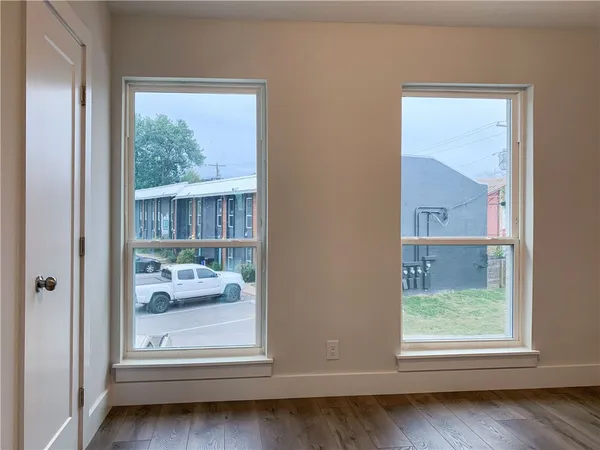 a kitchen with granite countertop white cabinets and stainless steel appliances