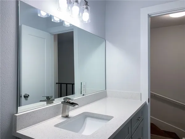 a kitchen with stainless steel appliances a stove a microwave and a refrigerator