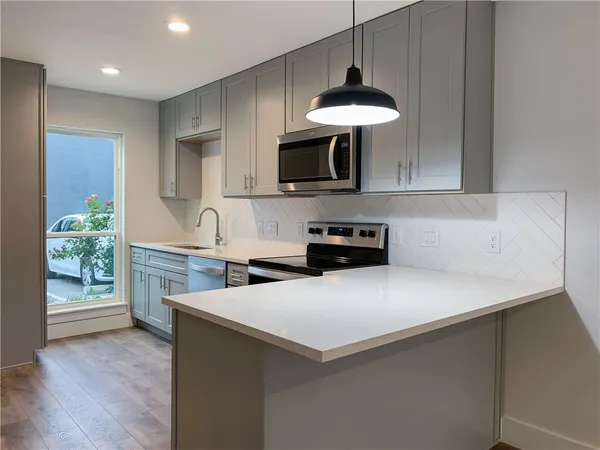 a bathroom with a sink a toilet and vanity
