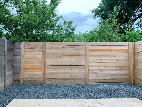 a view of an empty room and wooden floor