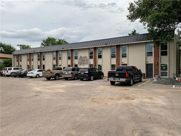 a view of a car parked in front of house