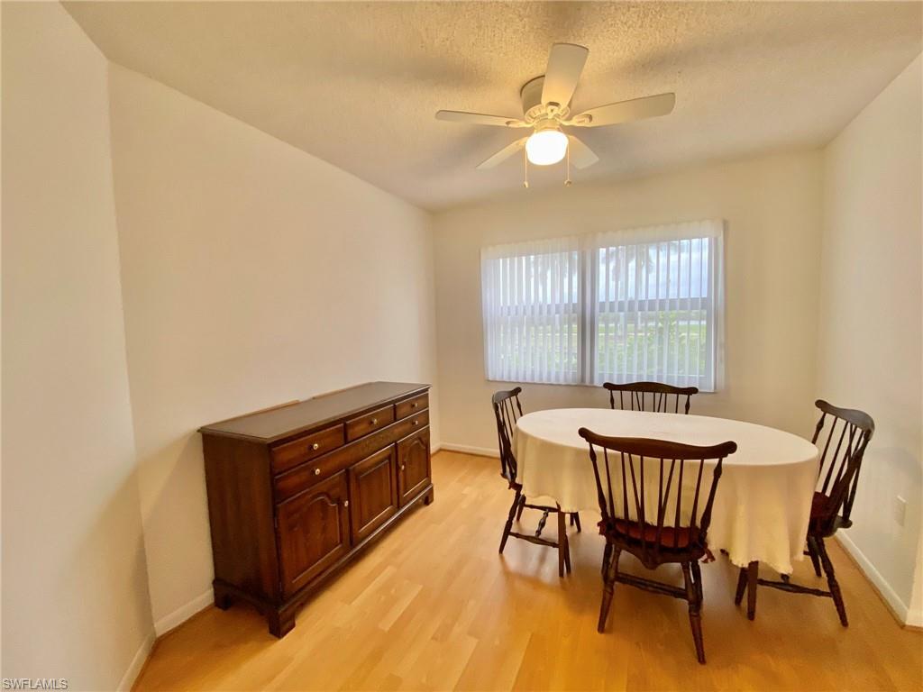 1516 Mainsail Drive, Unit 2 Naples, FL 34114 - Photo 22 of 45 a dining room with furniture and window