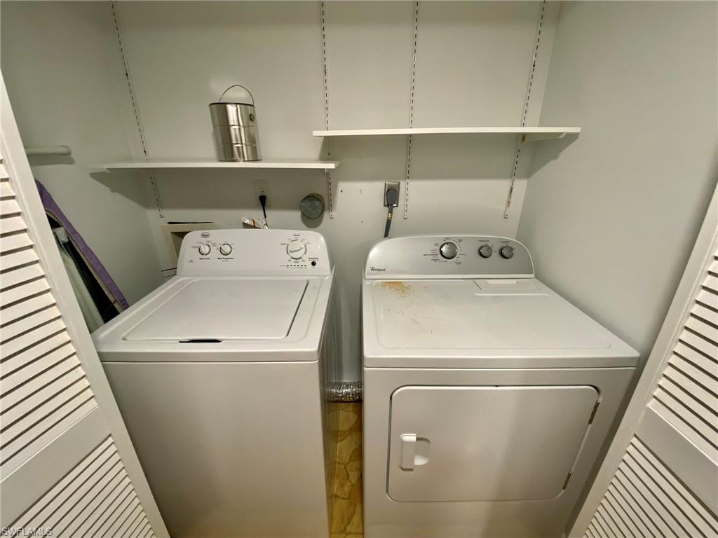 1516 Mainsail Drive, Unit 2 Naples, FL 34114 - Photo 38 of 45 a utility room with dryer and washer