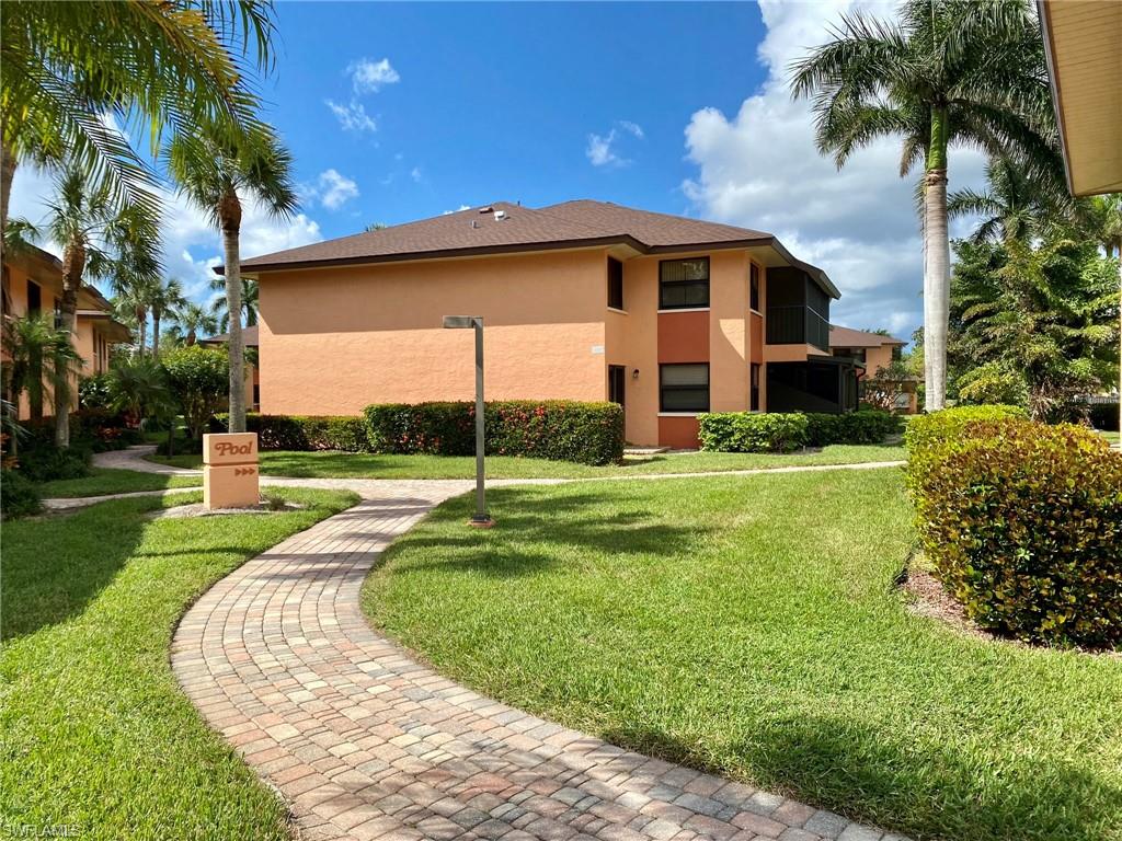 1516 Mainsail Drive, Unit 2 Naples, FL 34114 - Photo 42 of 45 a view of a house with a backyard