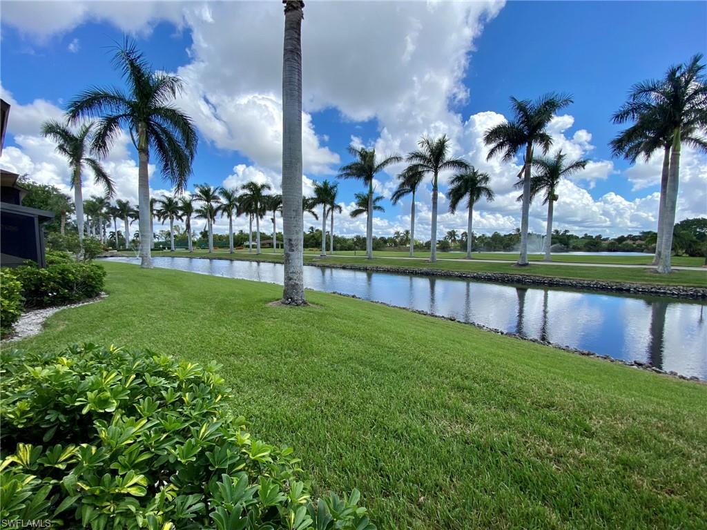 1516 Mainsail Drive, Unit 2 Naples, FL 34114 - Photo 43 of 45 a view of a lake and a yard