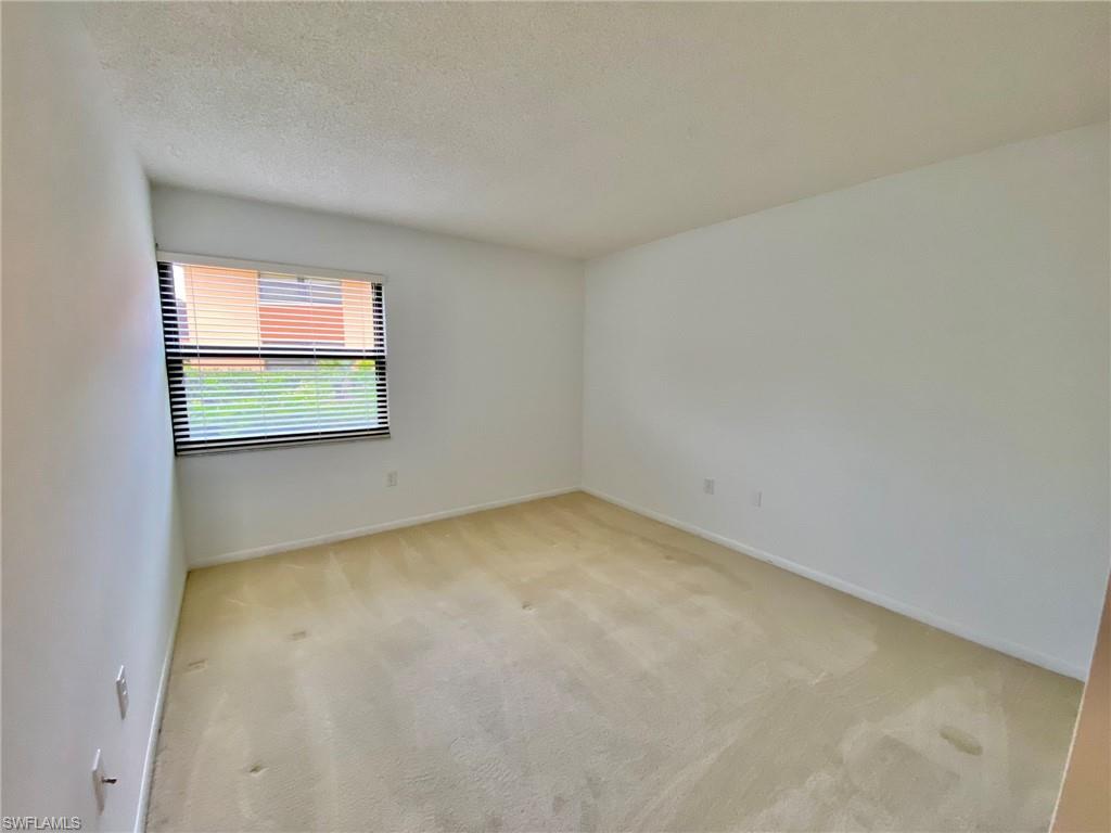 1516 Mainsail Drive, Unit 2 Naples, FL 34114 - Photo 6 of 45 a view of a room with a window