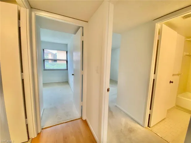 a view of a bathroom from a hallway