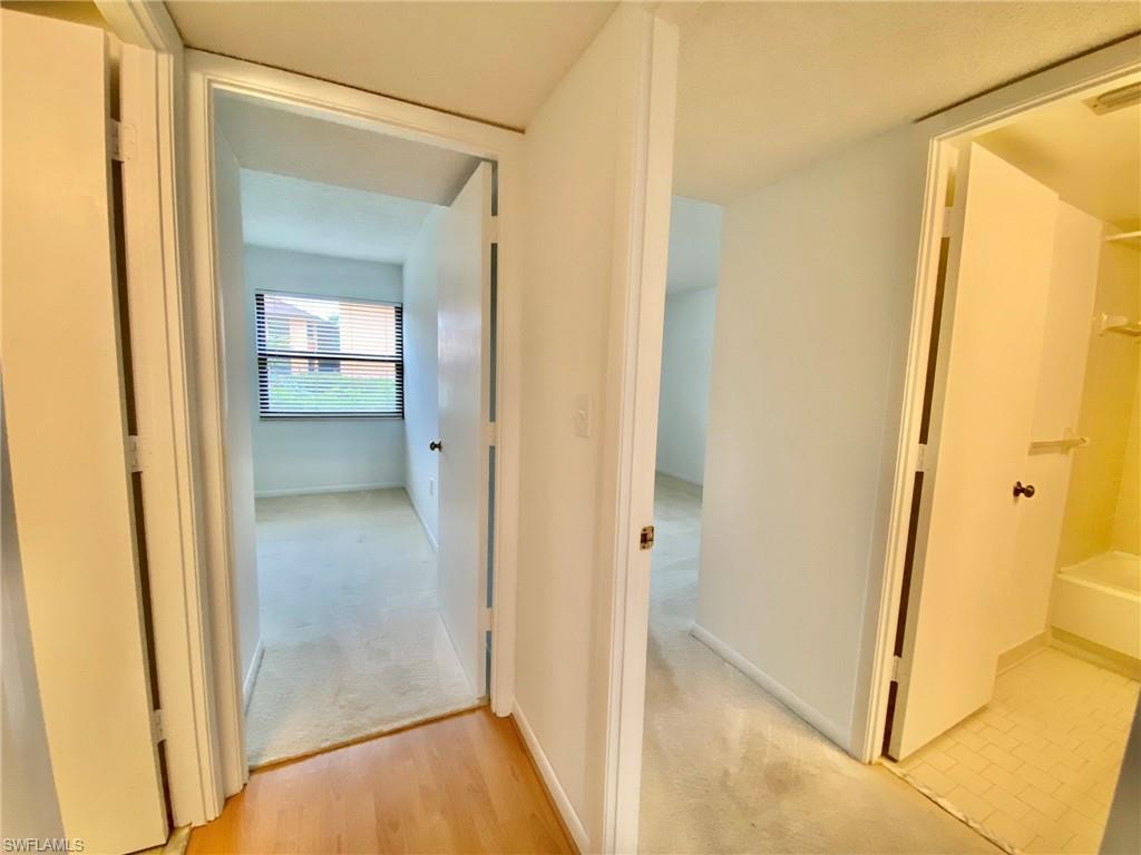 1516 Mainsail Drive, Unit 2 Naples, FL 34114 - Photo 8 of 45 a view of a bathroom from a hallway
